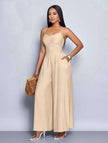 Beige pleated wide-leg jumpsuit with spaghetti straps and adjustable waist fit