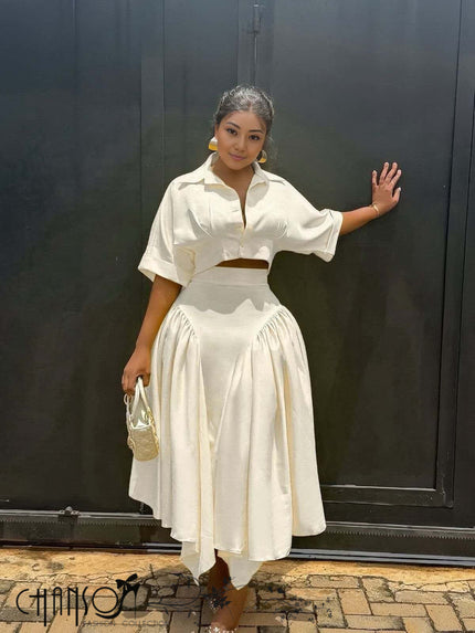 Cream midi dress with button-up shirt bodice and gathered full skirt