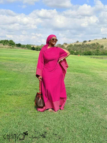 Maxi dress with flare sleeves and patchwork hem, fuchsia with patterned border