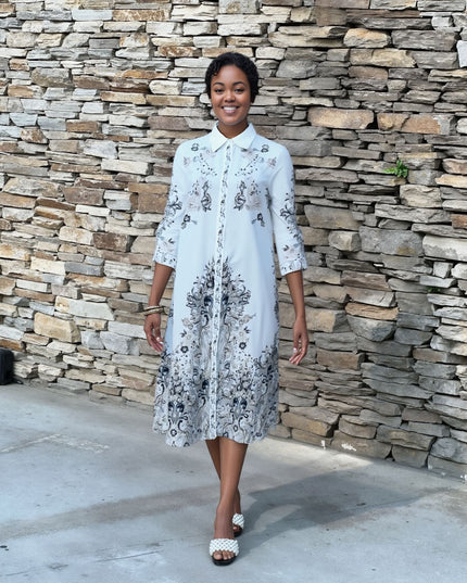 Plus size midi shirt dress in white with blue floral print, button-front, collared, 3/4 sleeves