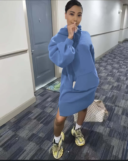 Light blue hoodie dress with relaxed fit, front pocket, and long sleeves