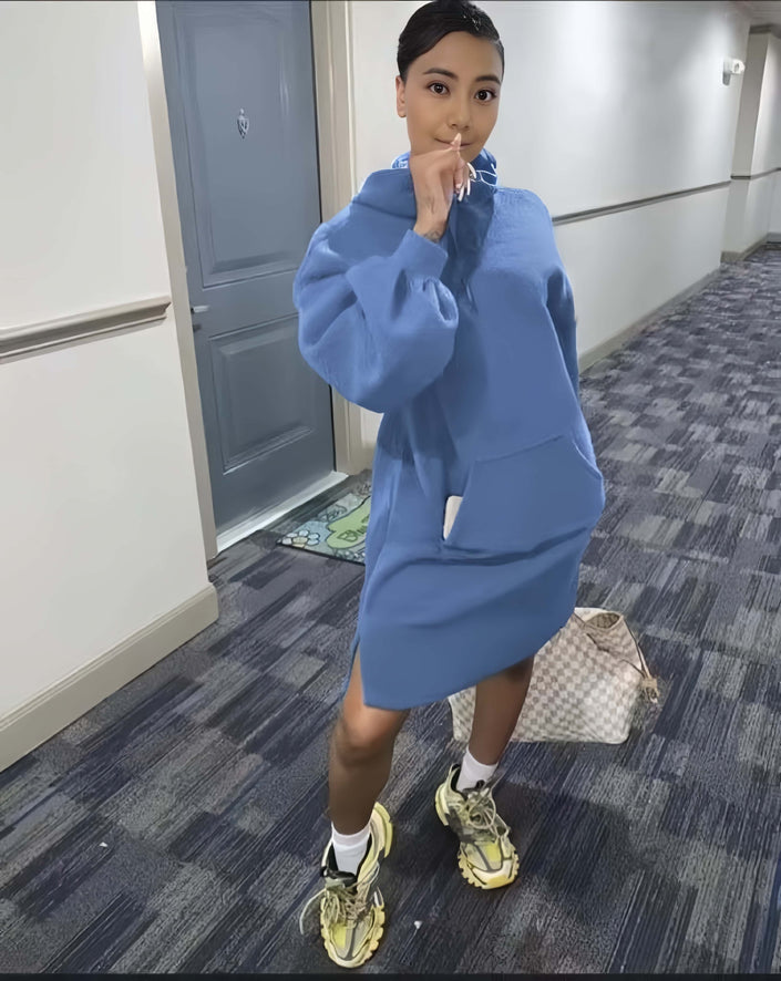Light blue hoodie dress with relaxed fit, front pocket, and long sleeves