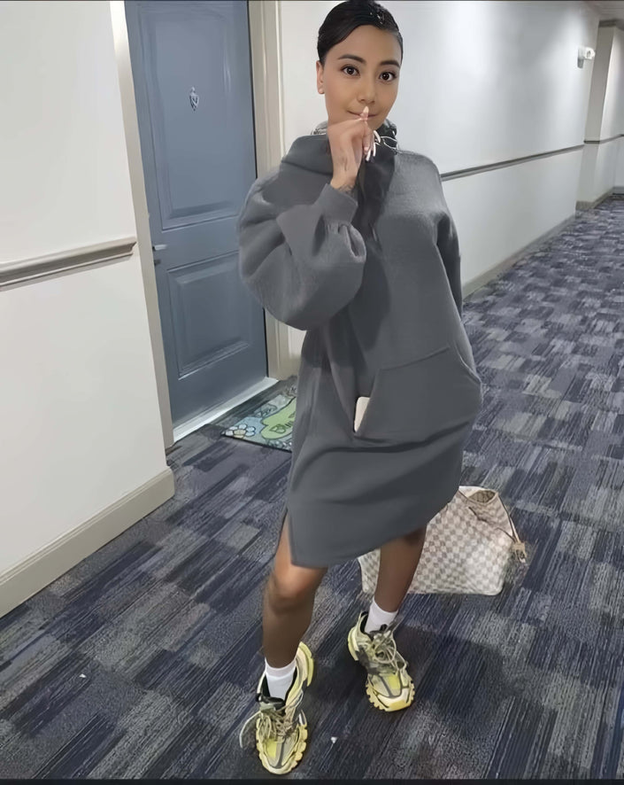 Grey hoodie dress with relaxed fit, front pocket, and long sleeves