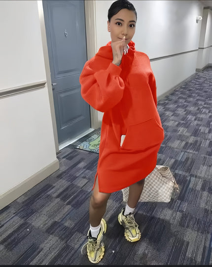 Orange-red hoodie dress with relaxed fit, front pocket, and long sleeves