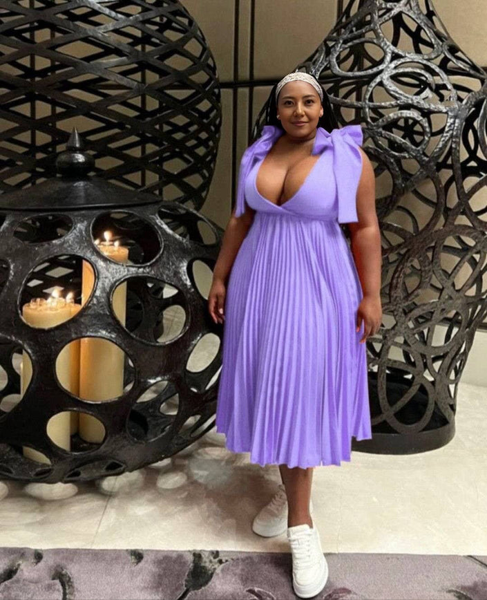 Light-purple pleated midi dress with bow shoulder straps and V-neckline