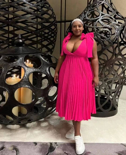 Deep-pink pleated midi dress with bow shoulder straps and V-neckline