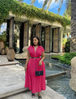 Hot-pink pleated midi dress with belted waist and short sleeves