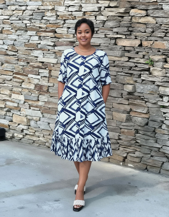 Plus size midi dress with blue-and-white geometric print and ruffle hem