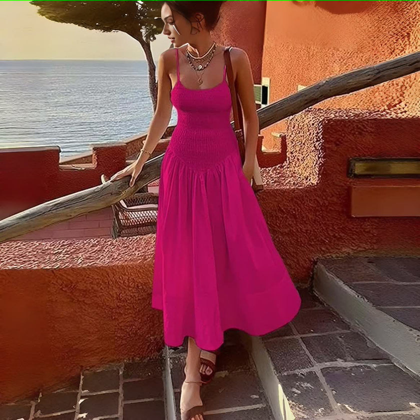 Deep-pink smocked bodice sleeveless dress with flared skirt and tiered pleats