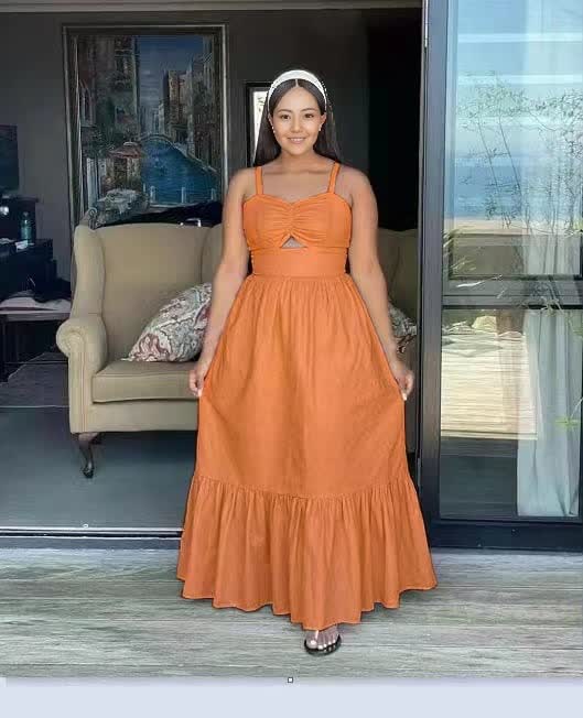 Orange sleeveless maxi dress with bow at bust and tiered ruffle hem