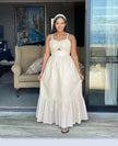 White sleeveless maxi dress with bow at bust and layered ruffle hem