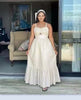 White sleeveless maxi dress with bow at bust and layered ruffle hem