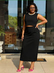 Black sleeveless cropped top and midi pencil skirt set with pearl collar necklace