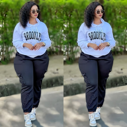 Light blue hoodie with BROOKLYN print and black jogger pants, loose fit