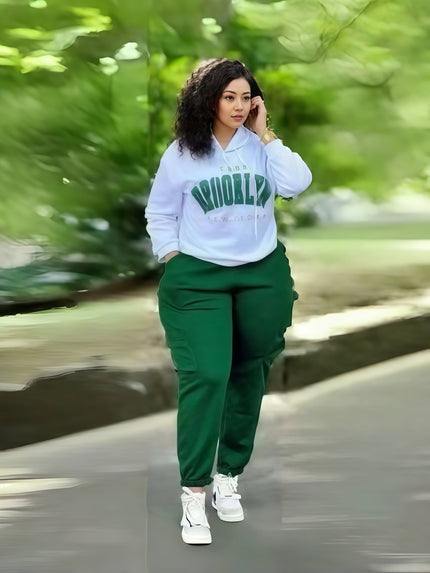 Light blue hoodie with colorful print and emerald green jogger pants, loose fit