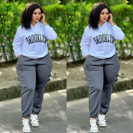 Light blue hoodie with BROOKLYN print and dark gray jogger pants, loose fit