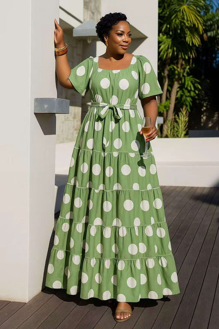Mint-green tiered polka dot midi dress with short sleeves and bow waist