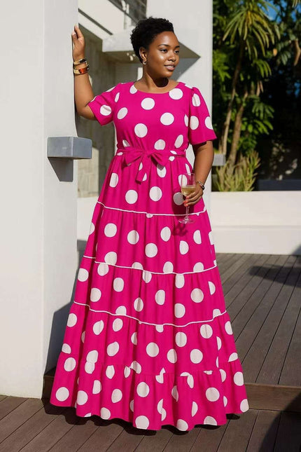 Hot-pink tiered polka dot midi dress with short sleeves and bow waist