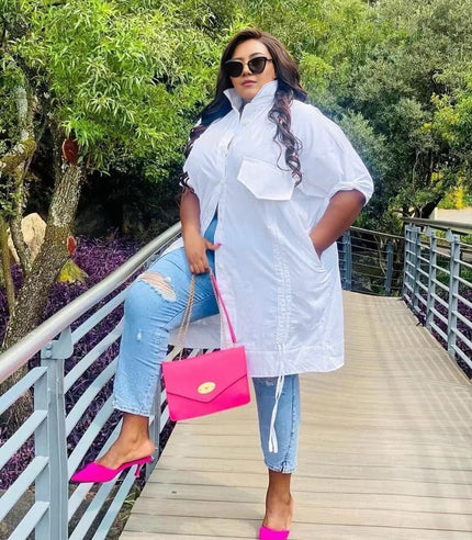 White plus-size shirt dress with cuffed sleeves and front chest pocket