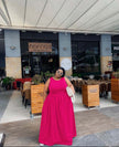 Deep-pink sleeveless maxi dress with gathered stretch waist and round neckline