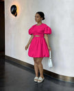Hot pink mini dress with puff sleeves and cut-out waist, gathered skirt