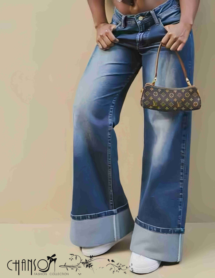 Wide-leg jeans with rolled cuffs in light-wash denim, button closure and belt loops