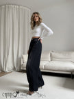 Black high-waist wide-leg jeans with button closure and front pockets