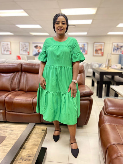 Lime-green ruffle midi dress with loose tiered skirt and short puff sleeves