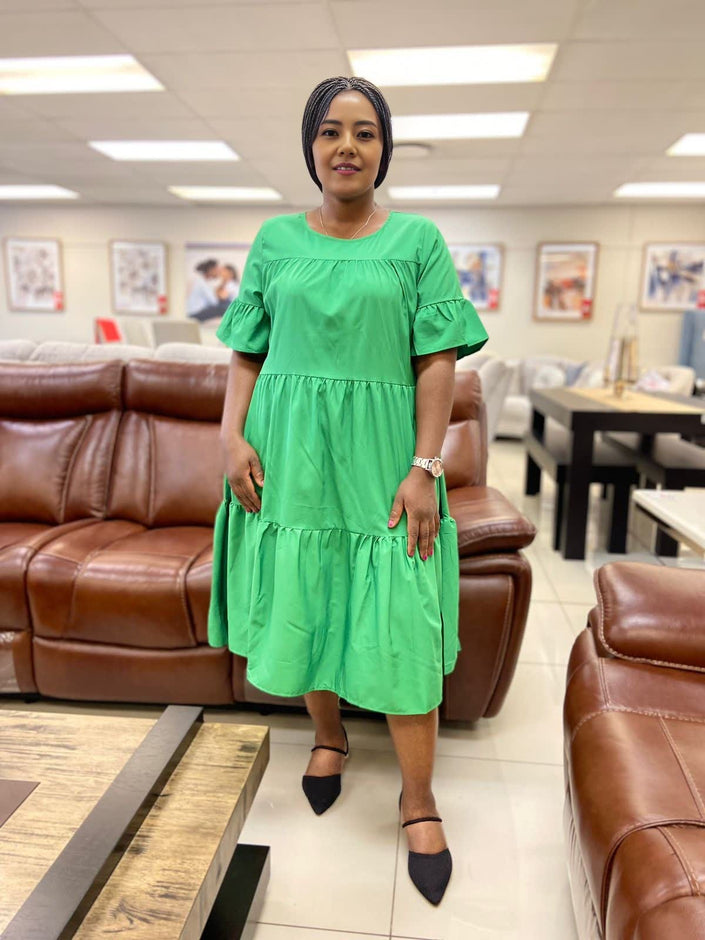 Lime-green ruffle midi dress with loose tiered skirt and short puff sleeves