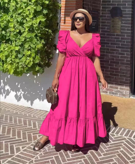 Pink puff-sleeve maxi dress with V-neck, cinched waist, and ruffle hem