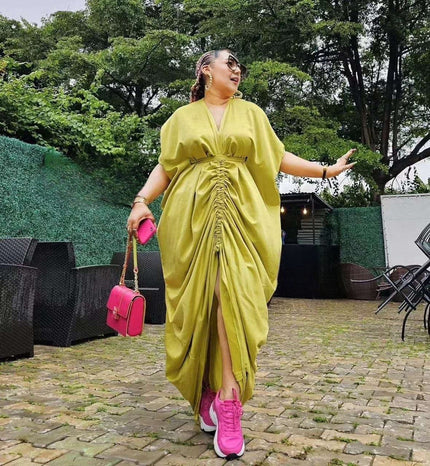 Light yellow ruched maxi dress with adjustable waist ties and front slit