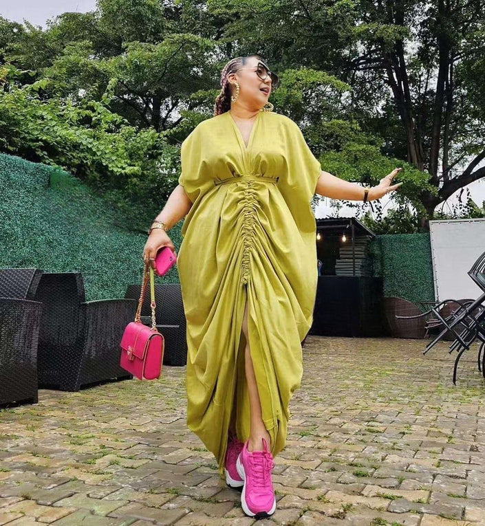 Light yellow ruched maxi dress with adjustable waist ties and front slit