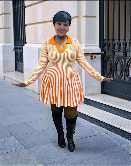 Pleated knit mini dress with vertical orange-and-white stripes and V neckline