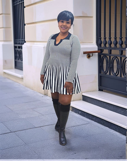 Pleated knit mini dress with vertical black-and-white stripes and V neckline