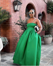 Lime-green pleated maxi dress with spaghetti straps