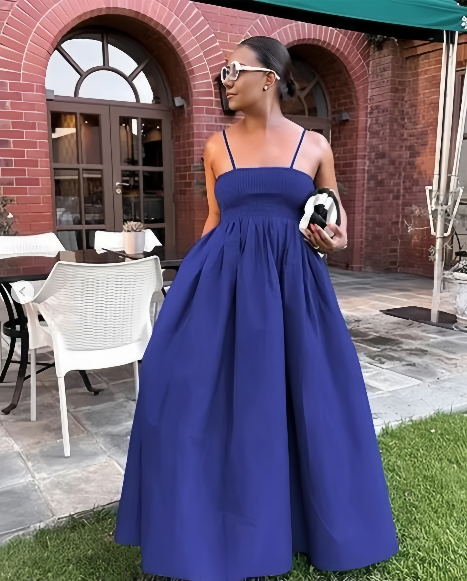 Blue pleated maxi dress with spaghetti straps and gathered waist