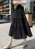 Black tiered pleated midi skirt with stretch waist and tiered ruffles