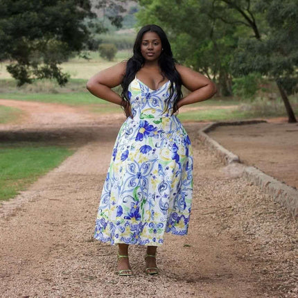 Floral maxi dress with adjustable straps, white base with blue and yellow bouquet print