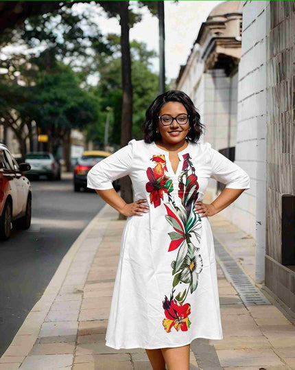 Plus size floral midi dress with V-neck, white with short sleeves and colorful bouquet print