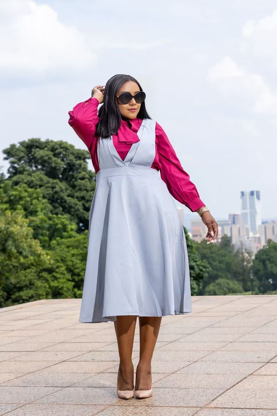 Light blue suspender midi dress with wide straps and gathered A-line skirt