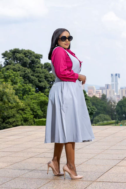 Light blue suspender midi dress with wide straps and pleated skirt