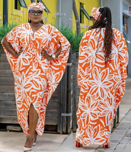 Plus size maxi dress with batwing sleeves, white-and-orange floral print, V-neck, side slit