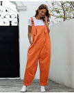 Orange loose-fit jumpsuit with adjustable straps and front bib pocket, wide-leg
