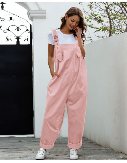 Pink loose-fit jumpsuit with adjustable straps and wide-leg pockets, stretch waist