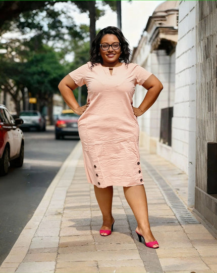 Pink plus size midi dress with short sleeves, V-neck, side pockets and button hem