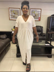 Cream V-neck maxi dress with short sleeves and gathered waist, center slit
