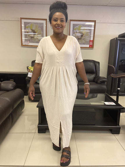 Cream V-neck maxi dress with short sleeves and gathered waist, center slit