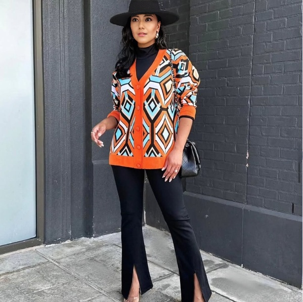 Geometric knit cardigan with orange contrast trim, button-front, long sleeves