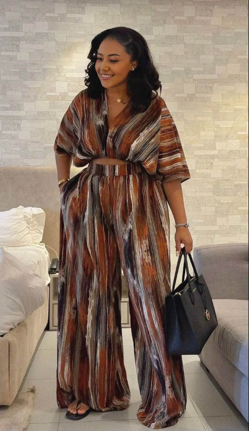 Loose-fit V-neck vertical stripe jumpsuit with short sleeves and tie waist