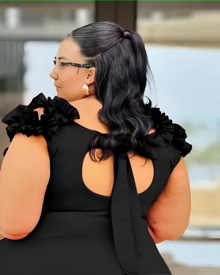 Black A-line midi dress with floral ruffle shoulder detail and neckline cutout